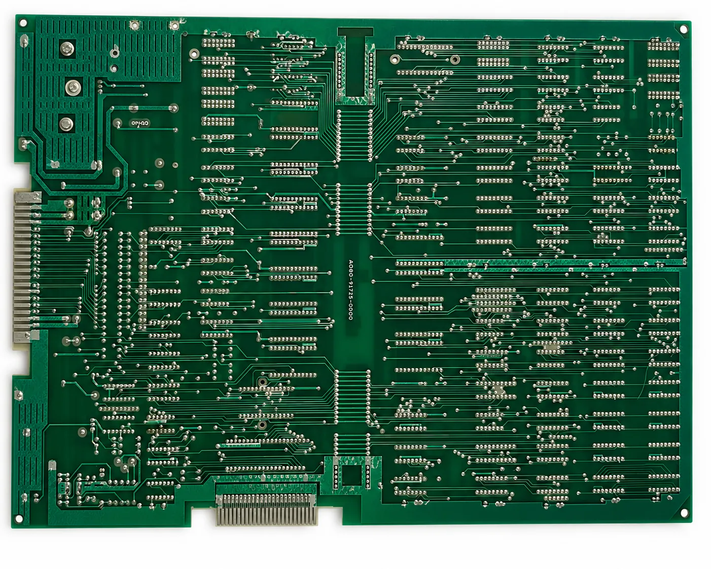 Complete solder side of an original Midway Pac-Man arcade PCB showing traces solder joints and repairs